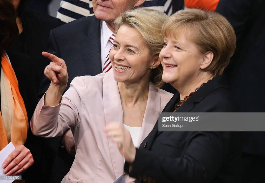 BERLIN, GERMANY - DECEMBER 17:  German Chancellor Angela Merkel (R) and Ursula
von der Leyen, who will become Germany's new Defense Minister, chat during a
vote at the Bundestag over her third term as chancellor during ceremonies in
which the new German government will be sworn in on December 17, 2013 in Berlin,
Germany. The new government is a coalition between the German Christian
Democrats (CDU), the Bavarian Christian Democrats (CSU) and German Social
Democrats (SPD) following federal elections held in September.  (Photo by Sean...